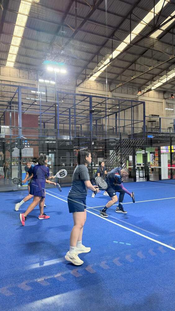 Group of four playing at the net, Baan Padel