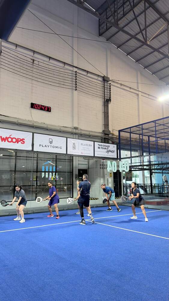 Group of players between games at Baan Padel